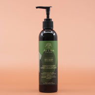 Das Haarpflegeprodukt AS I AM Rosemary Conditioner 237ml in der Vorderansicht vor einem braun-orangen Hintergrund.