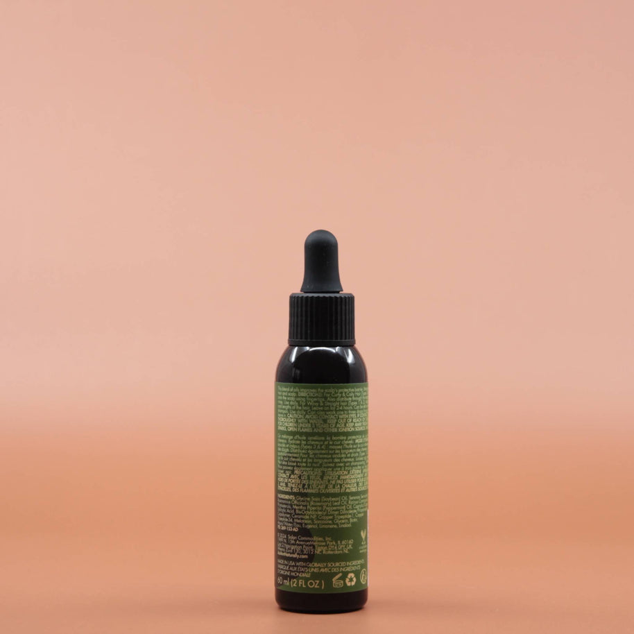 Das Haarpflegeprodukt AS I AM Rosemary Oil 60ml in der Rückansicht vor einem braun-orangen Hintergrund.