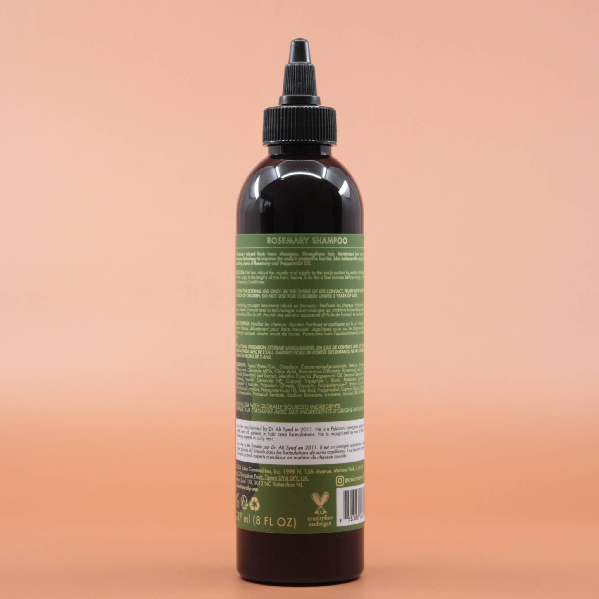 Das Haarpflegeprodukt AS I AM Rosemary Shampoo 237ml in der Rückansicht vor einem braun-orangen Hintergrund.