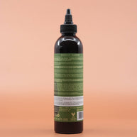 Das Haarpflegeprodukt AS I AM Rosemary Shampoo 237ml in der Rückansicht vor einem braun-orangen Hintergrund.