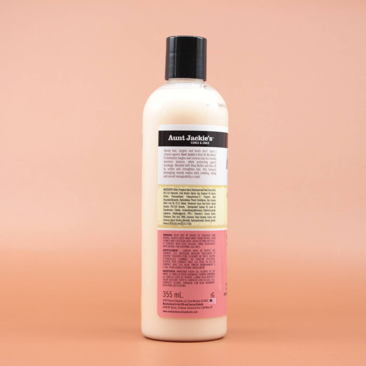 AUNT JACKIES Knot on my watch Instant Detangling Therapy 355ml in der Rückansicht vor einem braun-orangen Hintergrund