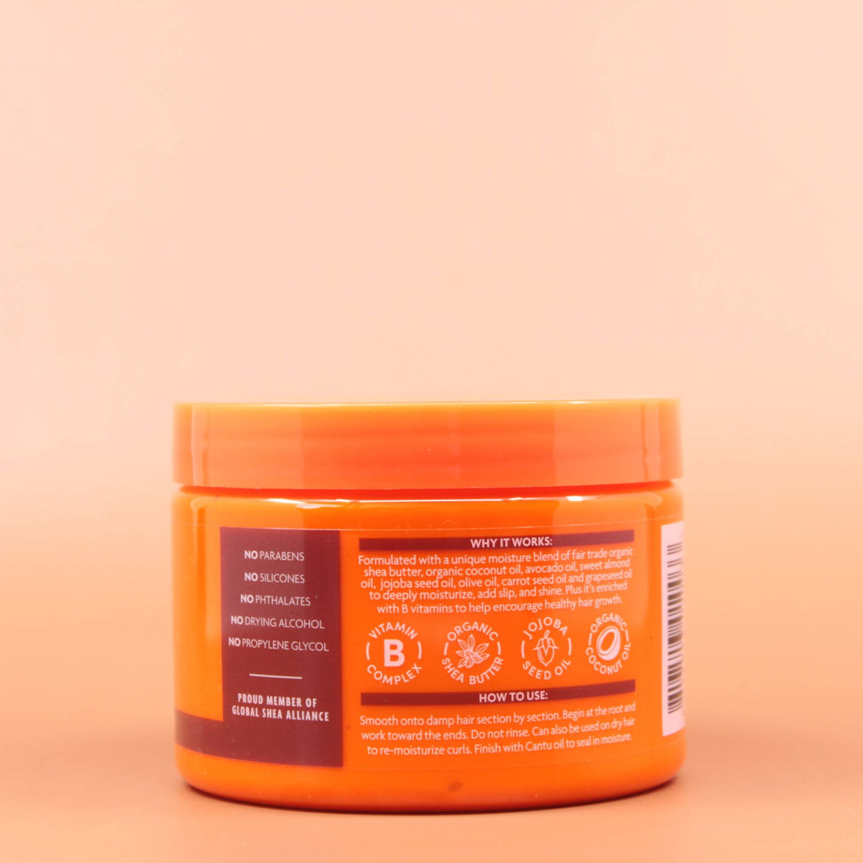 CANTU Coconut Curling Cream 340g Rückansicht des Produkts vor einem braunen Hintergrund.