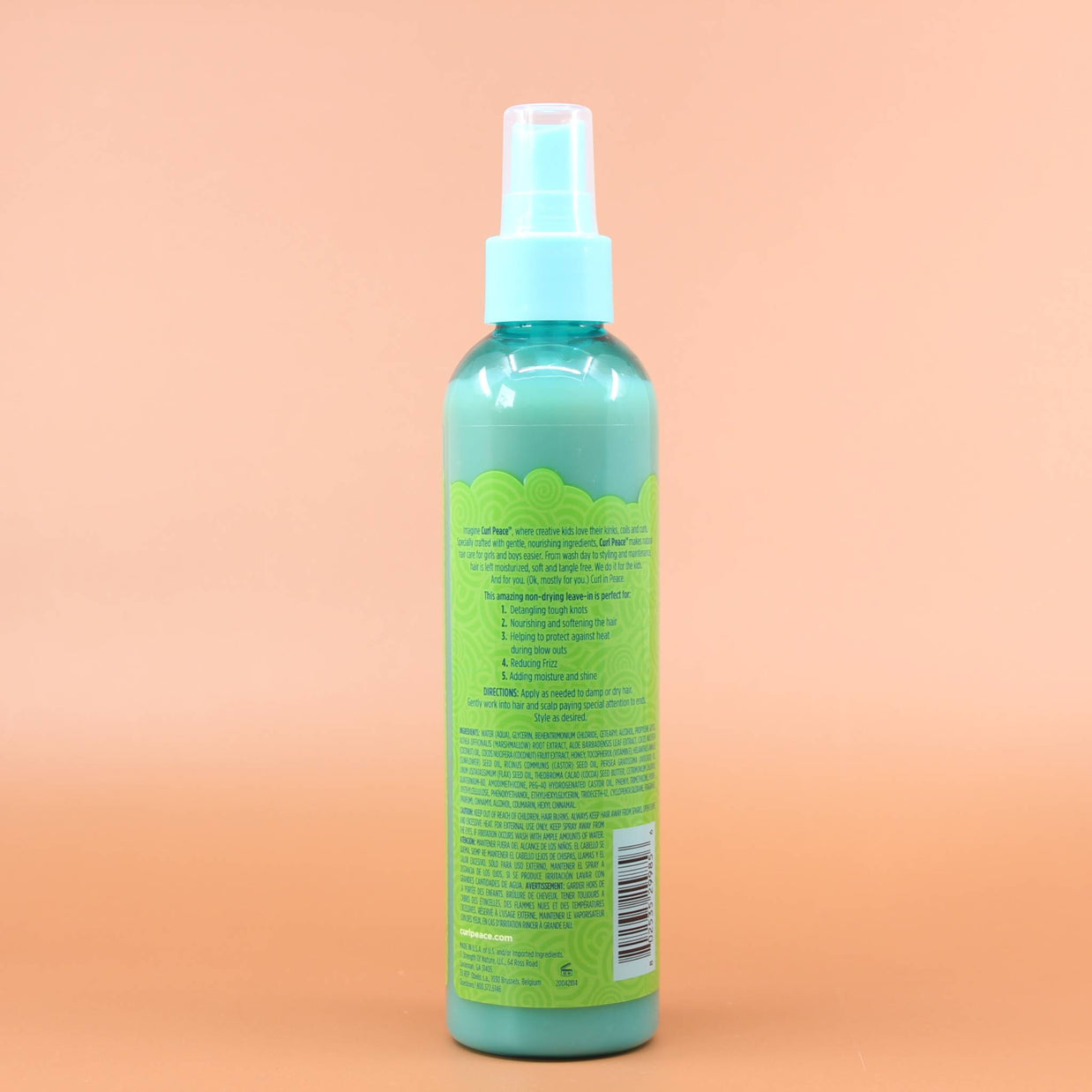 Das Produkt JUST FOR ME Curl Peace 5-in-1 Wonder Spray 237ml Rückansicht vor einen Braun-Orangenen Hintergrund